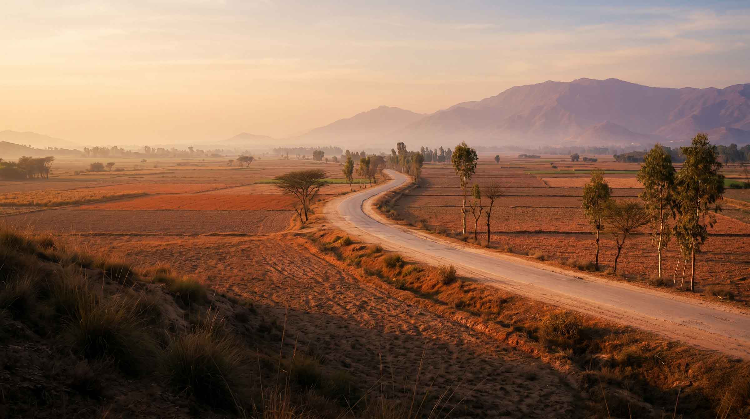 A road through the Pakistani countryside at golden hour